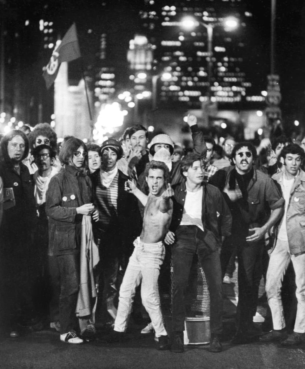 “Antiwar demonstrators protest outside the 1968 Democratic National Convention in Chicago. Shirtless protester Frank C. Plada later died while serving the U.S. Army in Vietnam. Photo by Perry Riddle.”